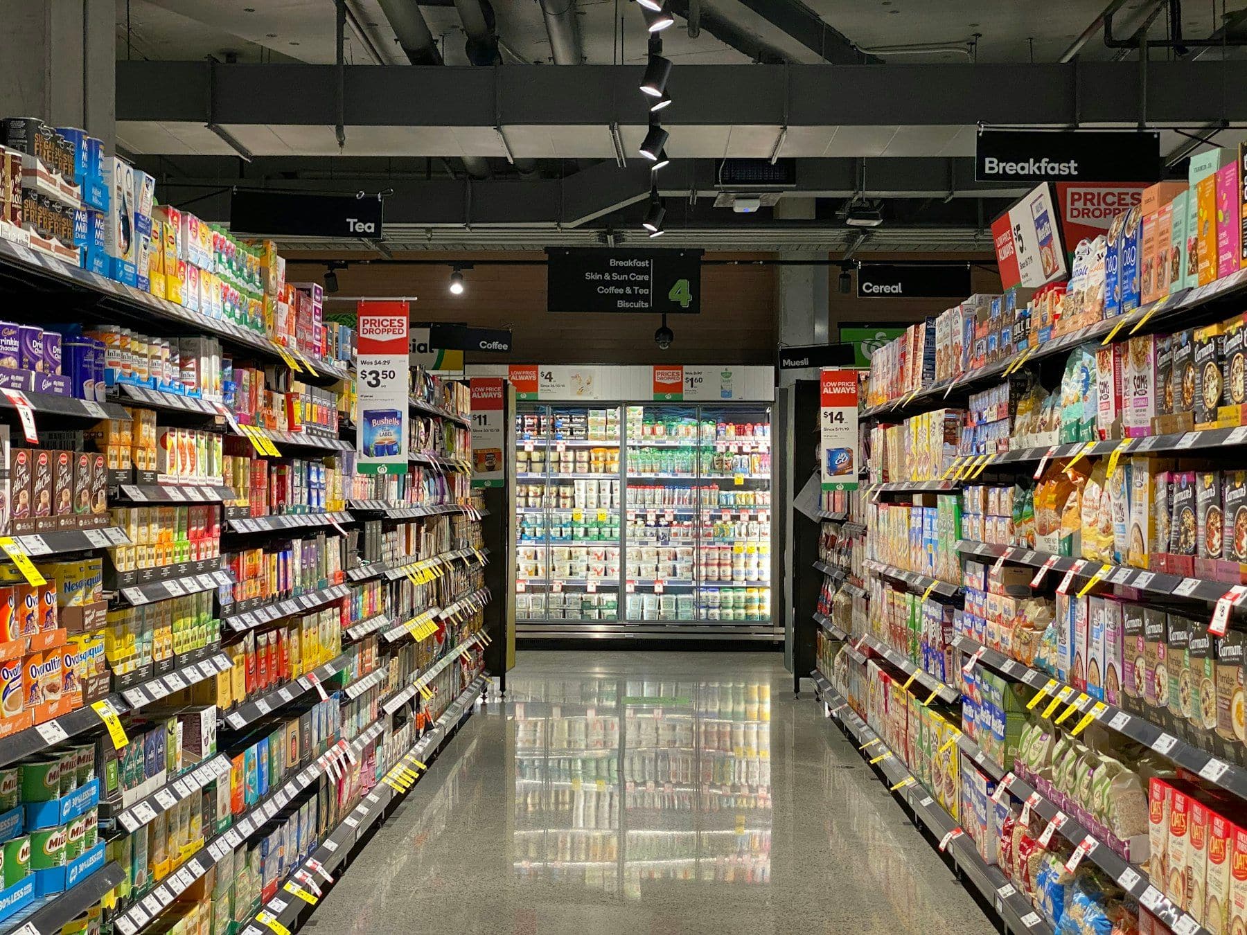 Supermarket aisle stocked for online grocery fulfilment