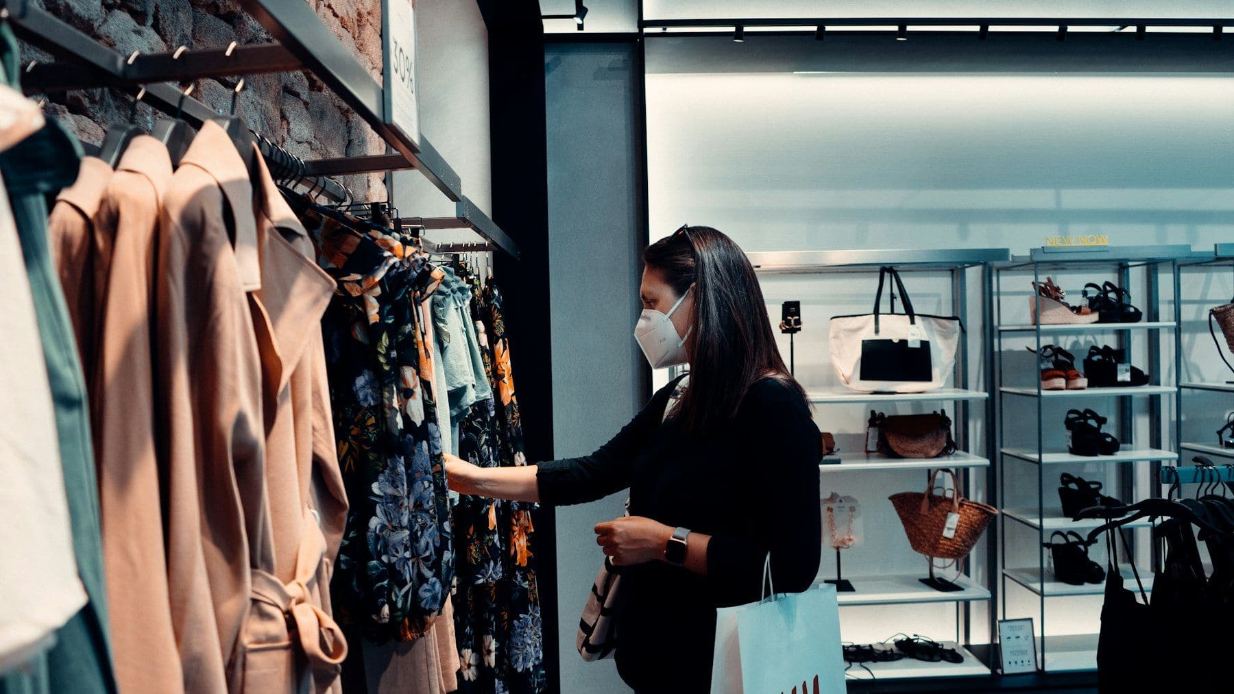 Customer browsing a boutique rail before ordering online