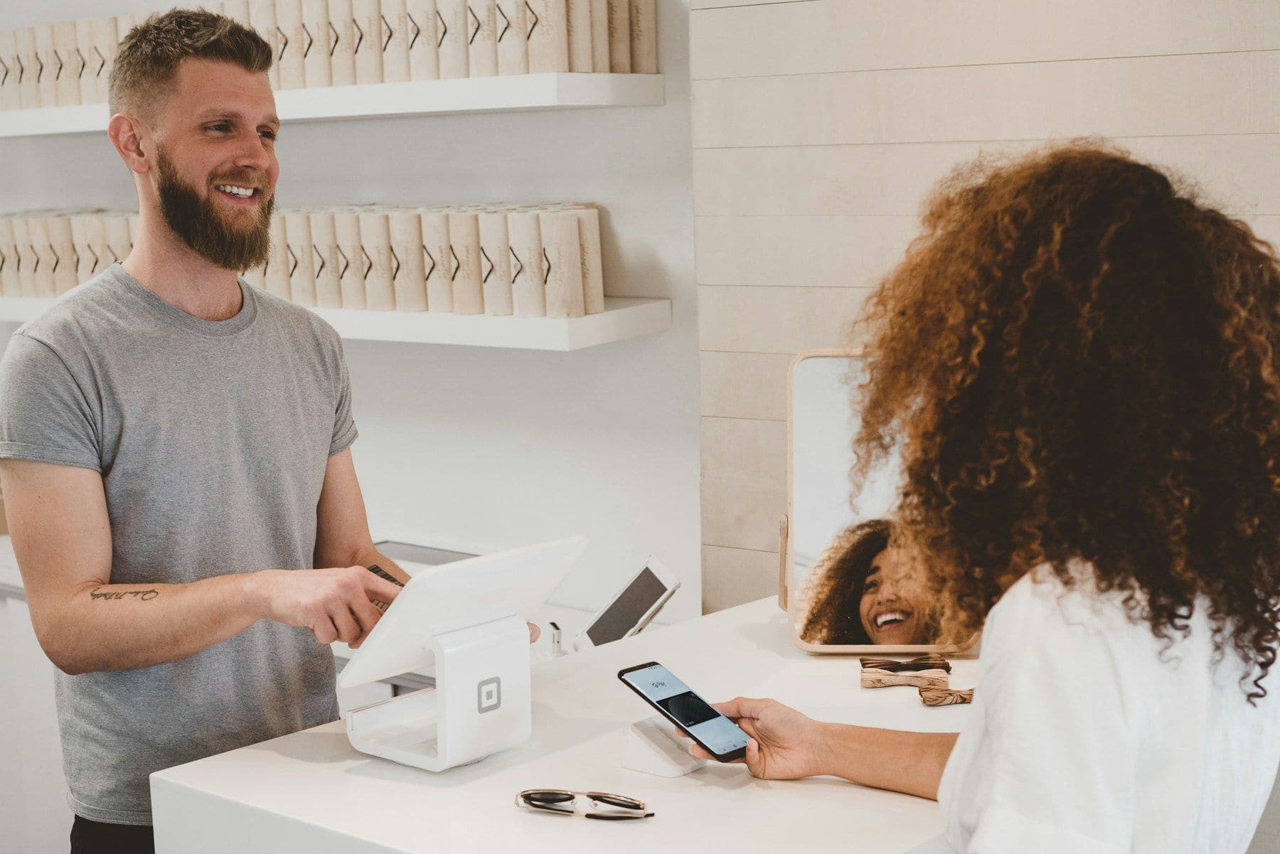 Business owner handing a completed order to a customer