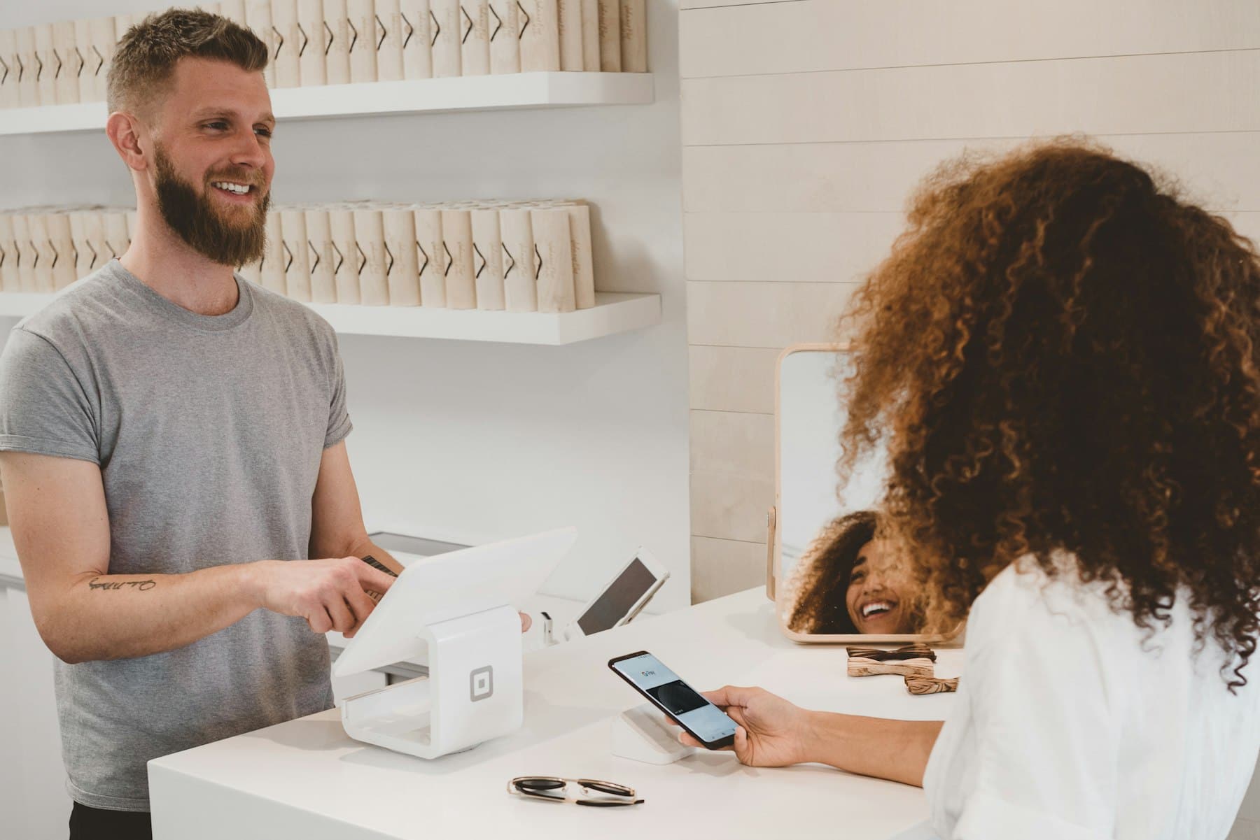 Customer paying by card at a point-of-sale terminal