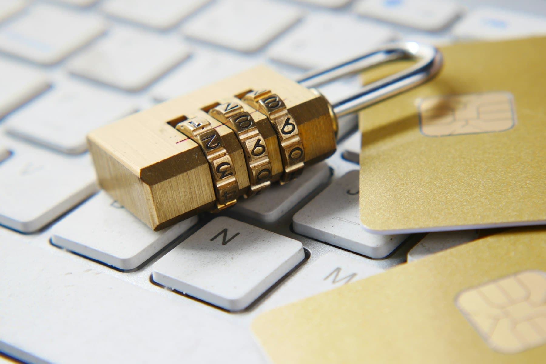 Padlock resting on a keyboard, representing financial data protection